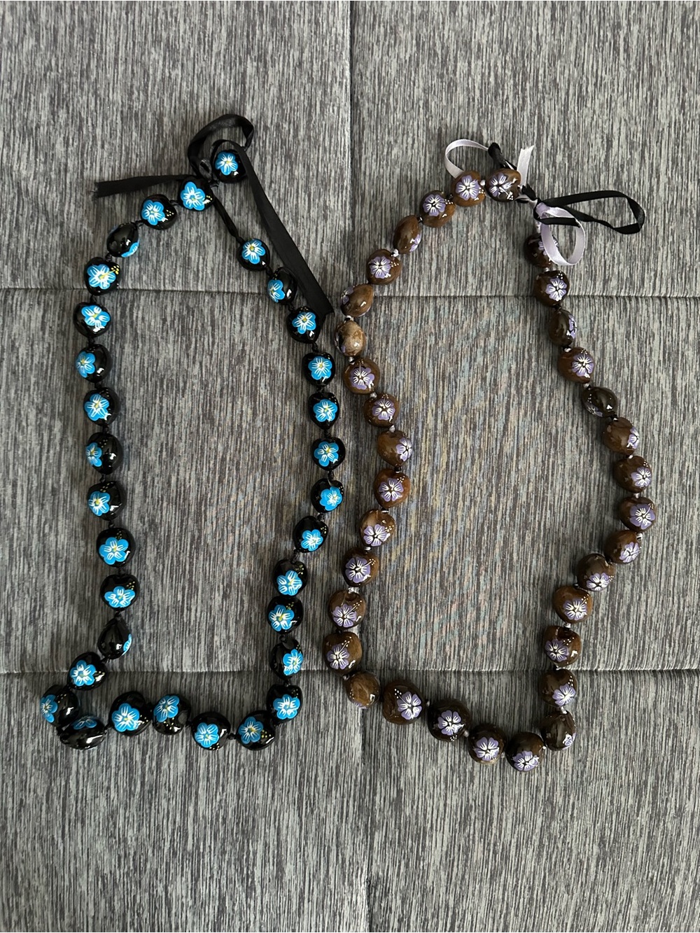 Two Hawaiian hand painted kukui nut lei necklaces